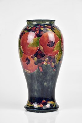 Lot 64 - WILLIAM MOORCROFT; a large vase of inverted...
