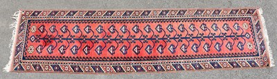 Lot 2369 - An Eastern style runner with stylised motifs...