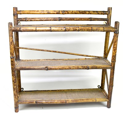 Lot 2476 - A free standing bamboo three tier shelf,...