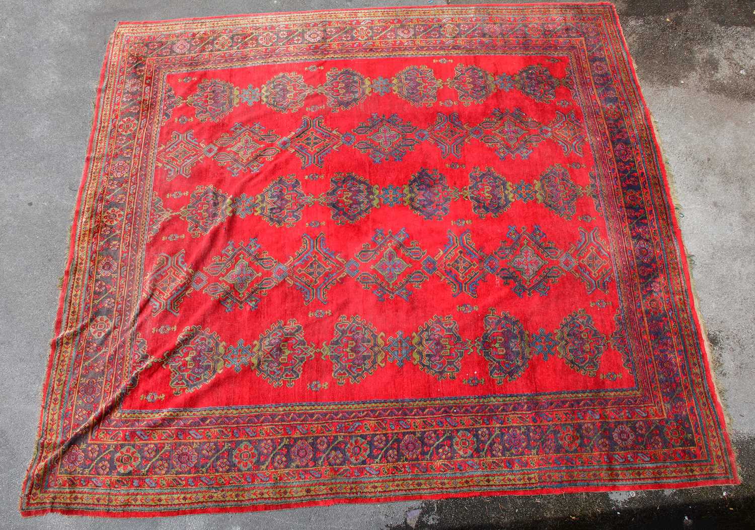 Lot 2322 A large hand knotted carpet with geometric