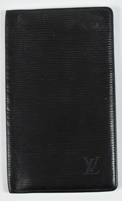 Lot 224 - IN THE STYLE OF LOUIS VUITTON; a black leather...