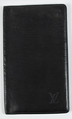 Lot 229 - IN THE STYLE OF LOUIS VUITTON; a black leather...