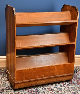 Lot 2439 - An oak freestanding bookcase with three fixed...