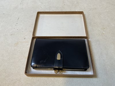 Lot 29 - GUCCI: an original boxed 1973 black leather...