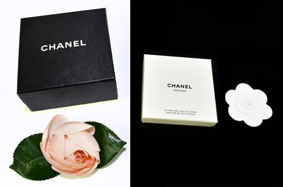 Lot 637 - CHANEL; a pink silk camelia flower with leaves...