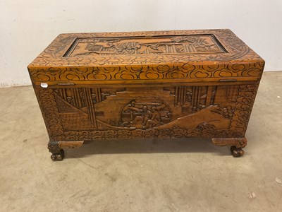 Lot 584 - A Chinese carved camphorwood rectangular...
