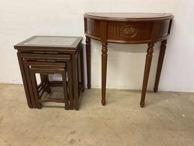 Lot 625 - An Oriental nest of three occasional tables...