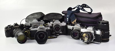 Lot 452 - A collection of cameras to include a Nikon FE,...