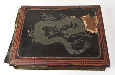 Lot 328 - A Japanese lacquered postcard album containing...