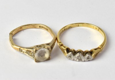 Lot 824 - A 9ct gold ring set with central white stone,...