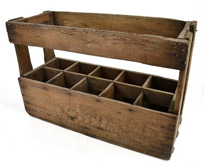 Lot 2106 - A wooden ten section bottle carrier, height...