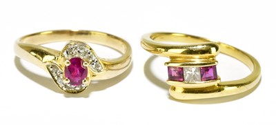 Lot 94 - An 18ct yellow gold diamond and ruby dress...