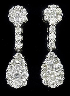 Lot 318 - A pair of 18ct white gold and diamond drop...