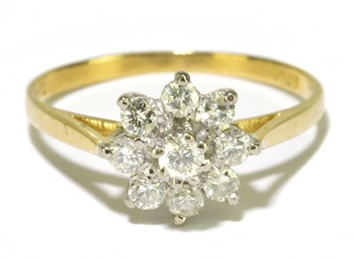 Lot 81 - An 18ct yellow gold and diamond flower head...