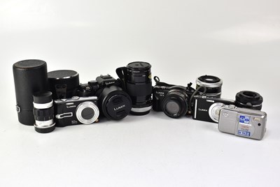 Lot 448 - A collection of cameras and lenses to include...