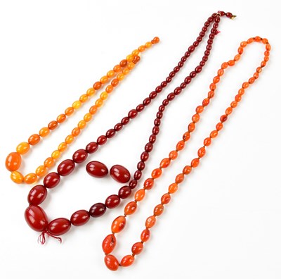 Lot 271 - A cherry amber coloured bead necklace,...