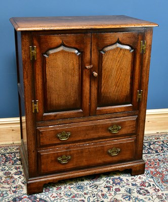 Lot 2584A - A modern oak TV cabinet with a pair of...