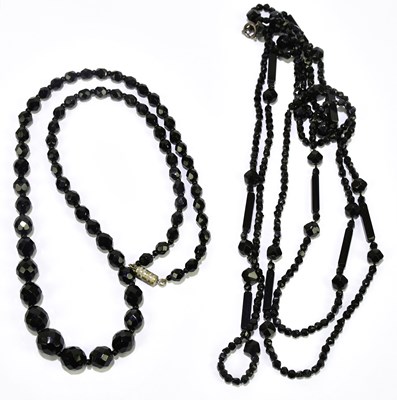 Lot 413 - Two jet necklaces, longest 143cm.