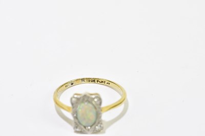 Lot 46 - An 18ct gold opal and diamond cluster ring,...