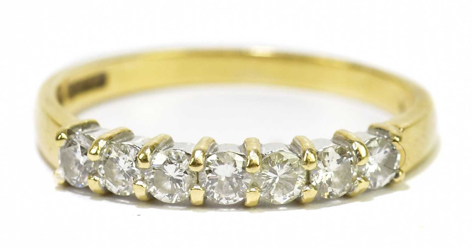 Lot 80 - An 18ct yellow gold seven stone diamond ring,