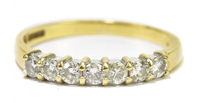 Lot 80 - An 18ct yellow gold seven stone diamond ring,...