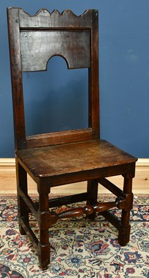 Lot 2453 - An 18th century oak correction chair, 100cm.