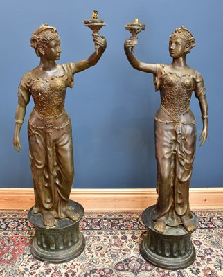 Lot 2124 - A large near pair of bronze lamps,...