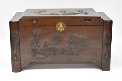 Lot 150 - A camphorwood chest with carved coastal scenes...