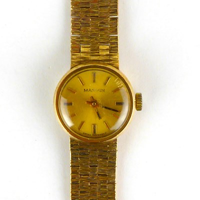 Lot 958 - MARVIN; a ladies' 9ct gold wristwatch, the...