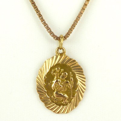 Lot 876 - A 9ct gold St. Christopher pendant on a dainty...