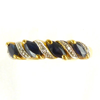 Lot 831 - A 9ct gold ring set with four diagonal...