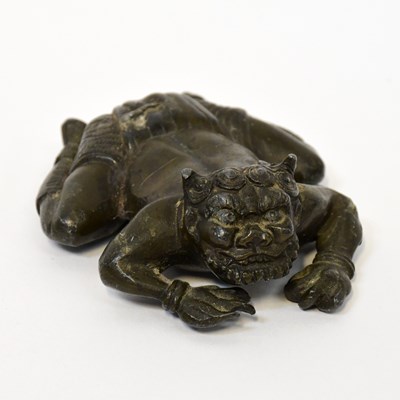 Lot 336 - An Indian bronzed squat figure of a demon,...