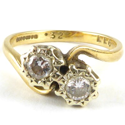 Lot 813 - A 9ct gold crossover ring set with two...