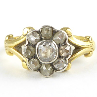 Lot 792 - A vintage 18ct gold diamond cluster ring, the...