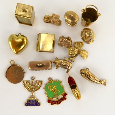 Lot 914 - Sixteen hallmarked 9ct gold charms, comprising...