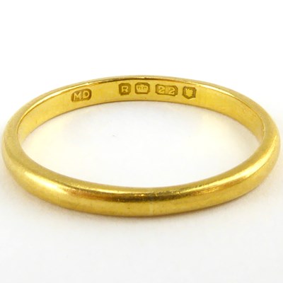 Lot 803 - A 22ct gold thin wedding band, size P, approx....