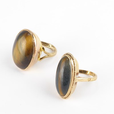 Lot 818 - Two 9ct gold tiger's eye rings, the largest...