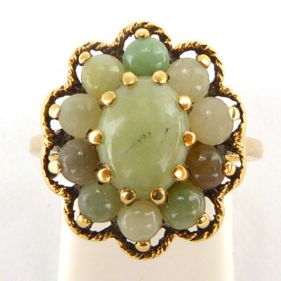 Lot 812 - A 9ct gold cluster ring, set with polished...