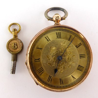 Lot 944 - A small 14kt gold open face pocket watch in...