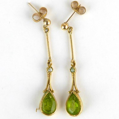 Lot 900 - A pair of 9ct gold peridot earrings in the...