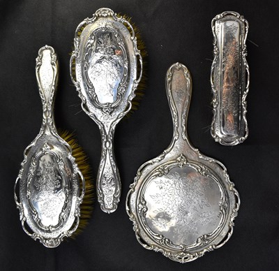 Lot 605 - An Edwardian hallmarked silver four-piece...