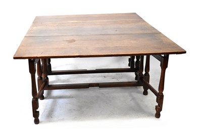 Lot 82 - A 19th century oak gateleg drop-leaf supper...