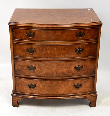 Lot 31 - A reproduction walnut veneered bow-fronted...