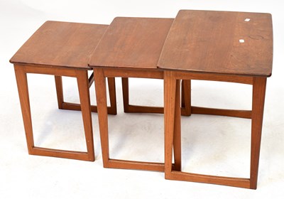 Lot 19 - A mid-20th century teak nest of three tables...