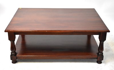 Lot 27 - A mahogany coffee table with tuned supports...