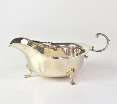 Lot 572 - A George V hallmarked silver sauce boat with...