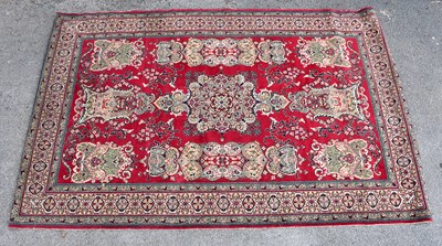 Lot 2367 - A red ground Kirman rug, 125 x 148cm.