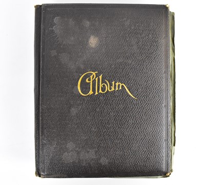 Lot 523 - An early 20th century postcard album...