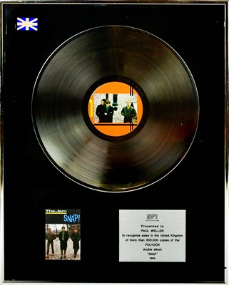 Lot 11 - THE JAM; a platinum disc presented to Paul...