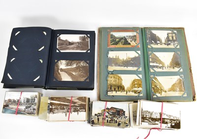 Lot 520 - Two early 20th century postcard albums and a...